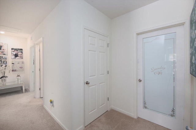 12314 SW Rimini Way, Port Saint Lucie, FL 34987 - corridor featuring light carpet and baseboards