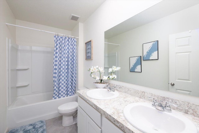 12314 SW Rimini Way, Port Saint Lucie, FL 34987 - bathroom featuring double vanity, shower / bath combo, toilet, and tile patterned flooring