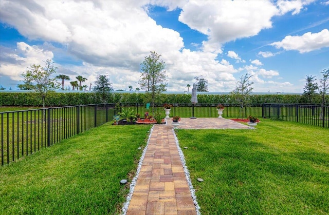 12314 SW Rimini Way, Port Saint Lucie, FL 34987 - view of yard with a patio area