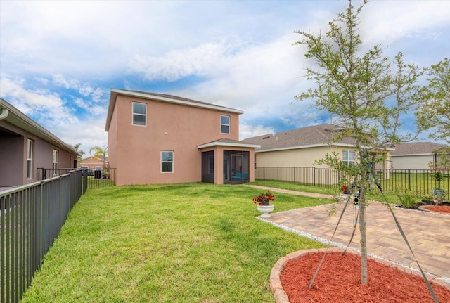 12314 SW Rimini Way, Port Saint Lucie, FL 34987 - back of property featuring a sunroom, stucco siding, and a patio area