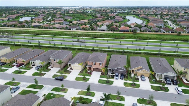 12314 SW Rimini Way, Port Saint Lucie, FL 34987 - aerial perspective of suburban area with a nearby body of water
