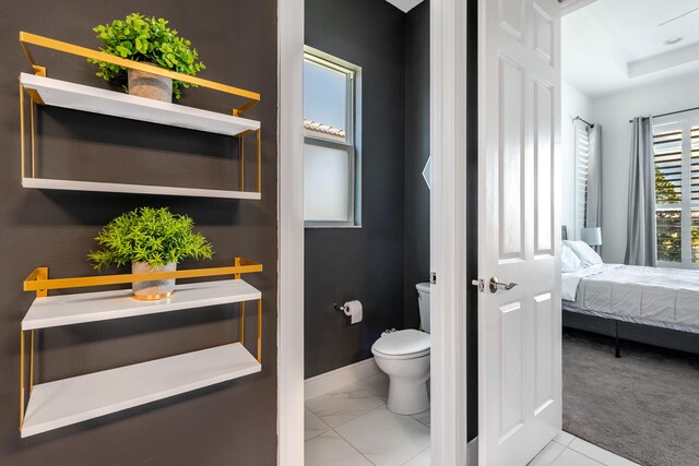 8762 SW Montova Way, Port Saint Lucie, FL 34987 - ensuite bathroom with toilet and baseboards