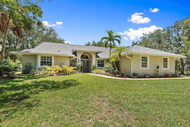 16673 75th Way N, Palm Beach Gardens, FL 33418 - ranch-style home featuring stucco siding and a front lawn