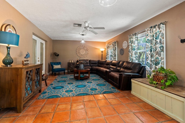 16673 75th Way N, Palm Beach Gardens, FL 33418 - living room with ceiling fan and a textured ceiling