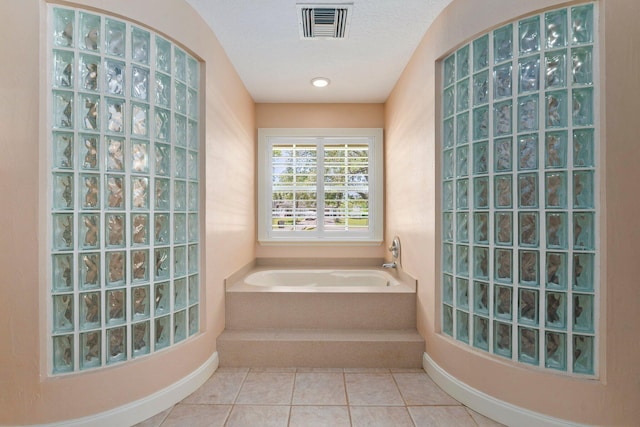16673 75th Way N, Palm Beach Gardens, FL 33418 - full bathroom featuring a bath and tile patterned floors