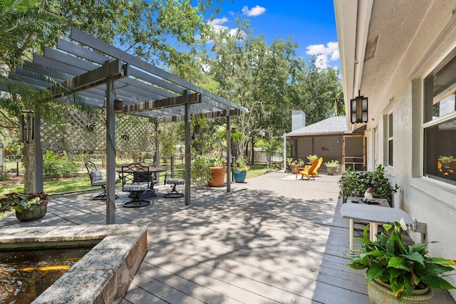16673 75th Way N, Palm Beach Gardens, FL 33418 - wooden deck with outdoor dining area and a pergola