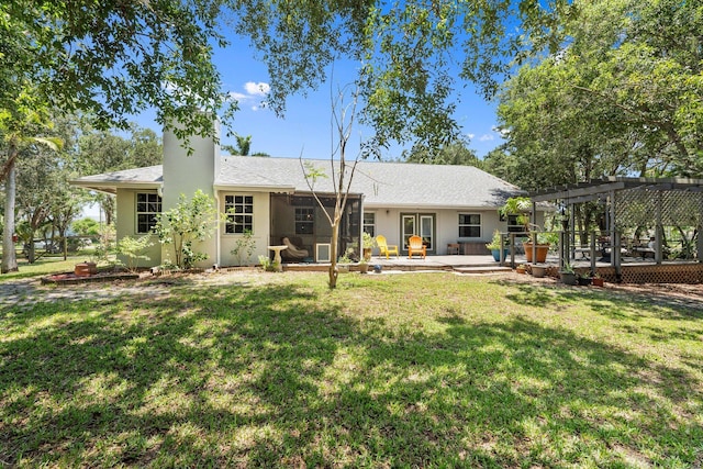 16673 75th Way N, Palm Beach Gardens, FL 33418 - rear view of house with a pergola, a lawn, a patio area, and a chimney