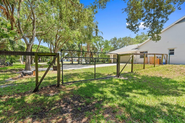 16673 75th Way N, Palm Beach Gardens, FL 33418 - view of yard featuring a gate