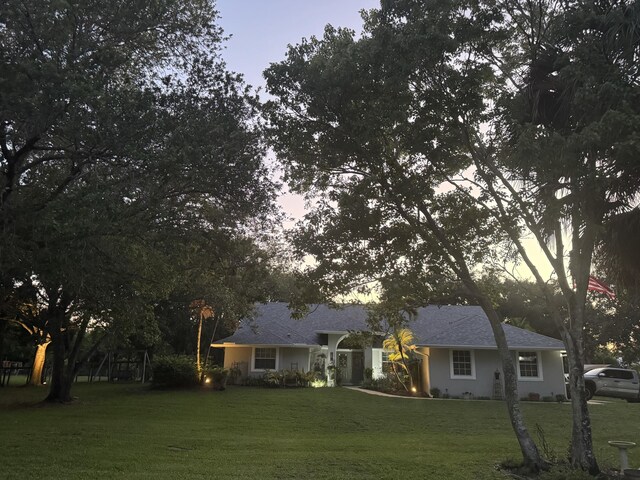 16673 75th Way N, Palm Beach Gardens, FL 33418 - ranch-style house with a front lawn