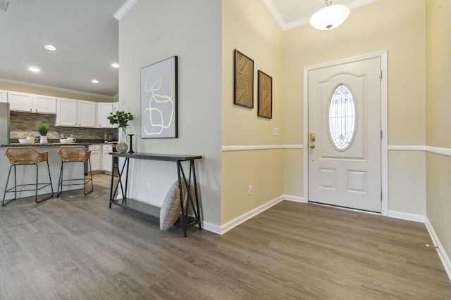 1649 Talbott St SE, Palm Bay, FL 32909 - entryway featuring crown molding, wood finished floors, baseboards, and recessed lighting