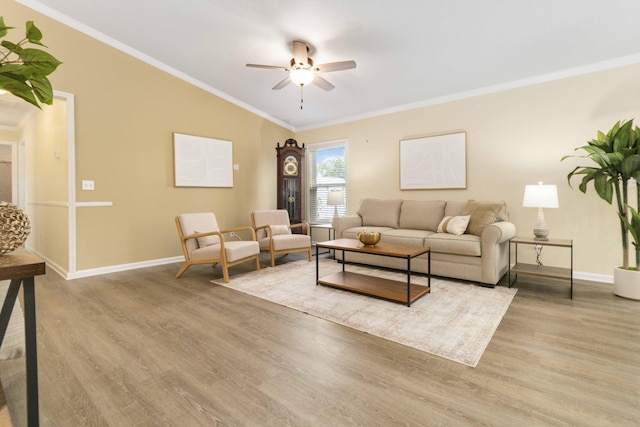1649 Talbott St SE, Palm Bay, FL 32909 - living room featuring a ceiling fan, wood finished floors, crown molding, baseboards, and vaulted ceiling