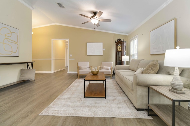 1649 Talbott St SE, Palm Bay, FL 32909 - living room with crown molding, wood finished floors, ceiling fan, lofted ceiling, and baseboards