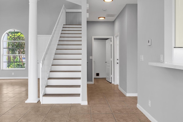 123 Canterbury Pl, Royal Palm Beach, FL 33414 - stairway featuring tile patterned floors, baseboards, and decorative columns