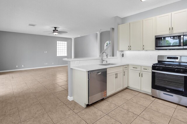 123 Canterbury Pl, Royal Palm Beach, FL 33414 - kitchen with stainless steel appliances, ceiling fan, open floor plan, and light tile patterned floors
