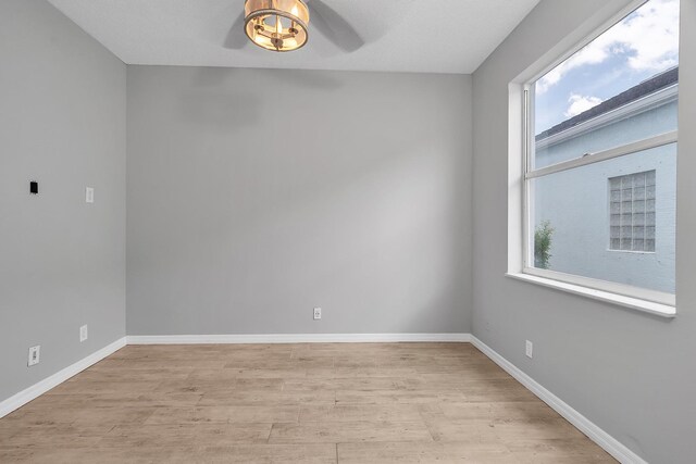 123 Canterbury Pl, Royal Palm Beach, FL 33414 - empty room featuring light wood-type flooring, plenty of natural light, baseboards, and ceiling fan