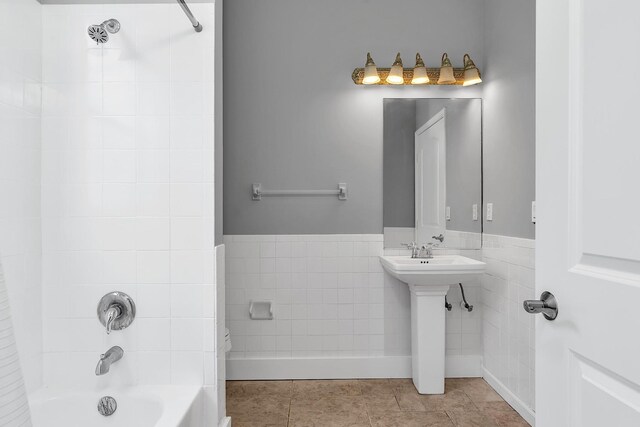 123 Canterbury Pl, Royal Palm Beach, FL 33414 - full bathroom with shower / washtub combination, tile patterned floors, tile walls, and a sink