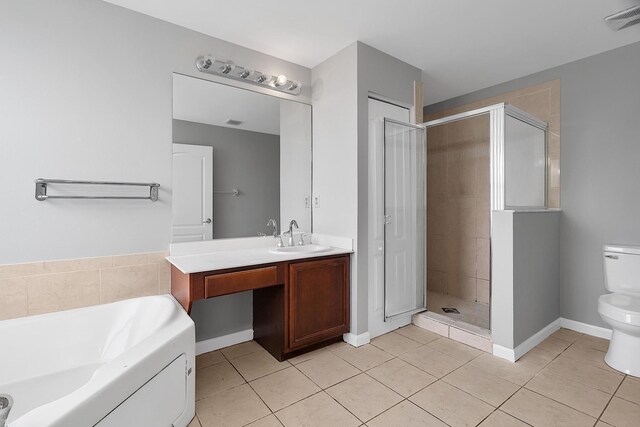 123 Canterbury Pl, Royal Palm Beach, FL 33414 - bathroom with tile patterned flooring, a garden tub, a stall shower, toilet, and vanity
