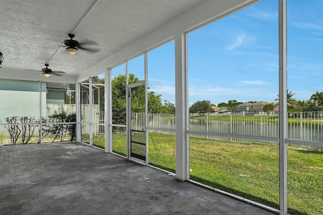 123 Canterbury Pl, Royal Palm Beach, FL 33414 - unfurnished sunroom featuring a water view, ceiling fan, and healthy amount of natural light