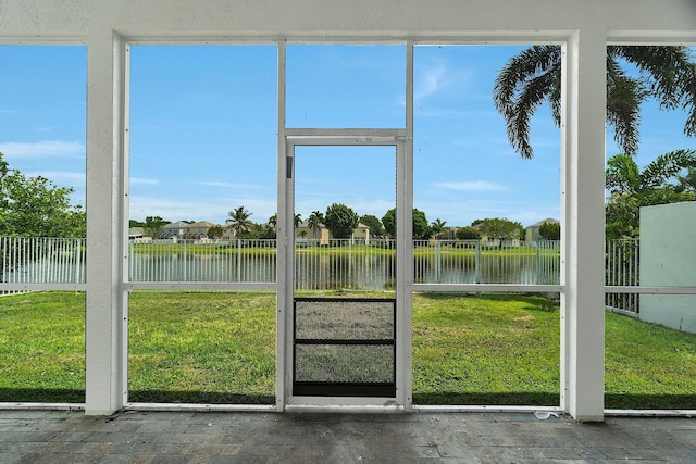 123 Canterbury Pl, Royal Palm Beach, FL 33414 - unfurnished sunroom featuring a water view and healthy amount of natural light