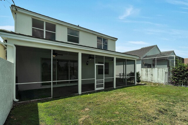 123 Canterbury Pl, Royal Palm Beach, FL 33414 - back of property featuring ceiling fan, a sunroom, and stucco siding