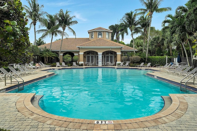 123 Canterbury Pl, Royal Palm Beach, FL 33414 - community pool featuring a patio