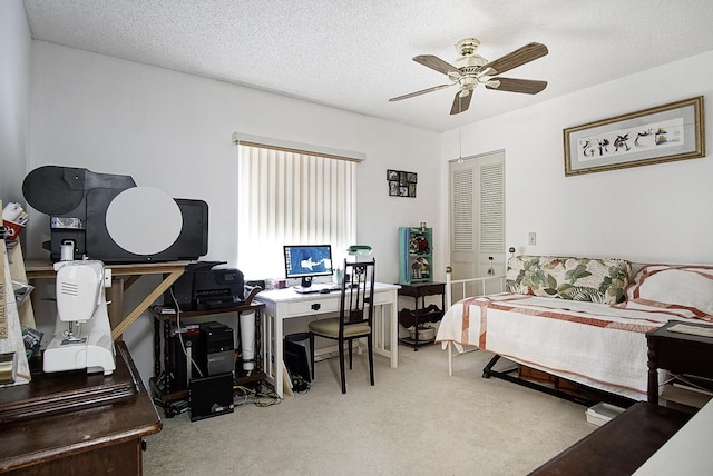 5930 Whispering Pines Way Unit C-2, Greenacres, FL 33463 - bedroom with carpet floors, an office area, a closet, ceiling fan, and a textured ceiling