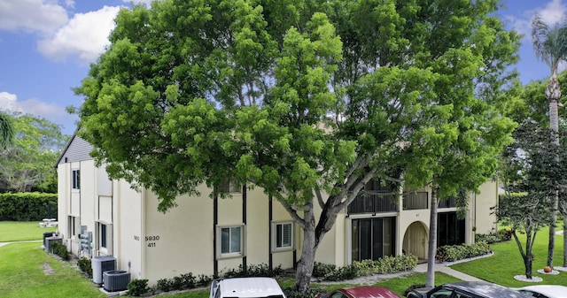 5930 Whispering Pines Way Unit C-2, Greenacres, FL 33463 - view of building exterior featuring central air condition unit