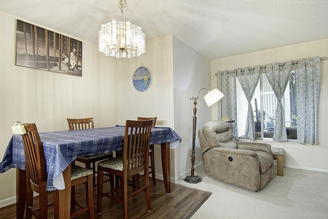 5930 Whispering Pines Way Unit C-2, Greenacres, FL 33463 - dining room featuring a chandelier, baseboards, a textured ceiling, and carpet