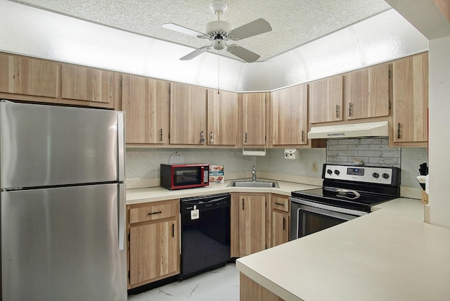 5930 Whispering Pines Way Unit C-2, Greenacres, FL 33463 - kitchen with stainless steel appliances, under cabinet range hood, a sink, light countertops, and a textured ceiling