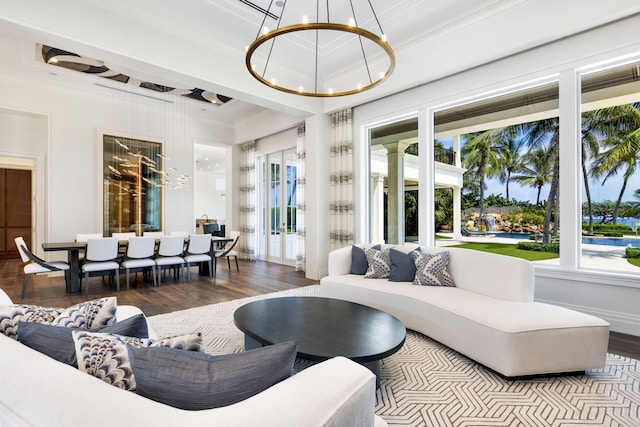 526 N Ocean Blvd, Delray Beach, FL 33483 - living room featuring wood finished floors, ornamental molding, and a chandelier
