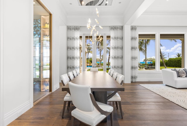 526 N Ocean Blvd, Delray Beach, FL 33483 - dining area with a chandelier, crown molding, plenty of natural light, wood finished floors, and baseboards