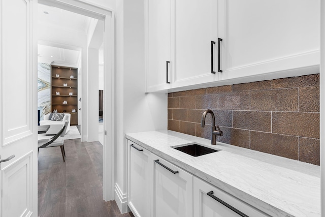 526 N Ocean Blvd, Delray Beach, FL 33483 - bar featuring a sink, backsplash, and dark wood-type flooring