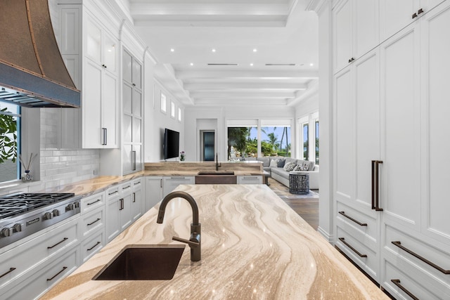 526 N Ocean Blvd, Delray Beach, FL 33483 - kitchen with custom range hood, a sink, open floor plan, decorative backsplash, and recessed lighting