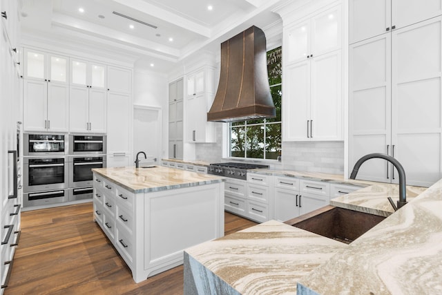 526 N Ocean Blvd, Delray Beach, FL 33483 - kitchen with custom exhaust hood, appliances with stainless steel finishes, a sink, crown molding, and backsplash