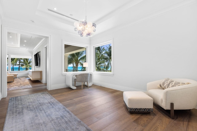 526 N Ocean Blvd, Delray Beach, FL 33483 - sitting room with a raised ceiling, a chandelier, wood finished floors, baseboards, and crown molding