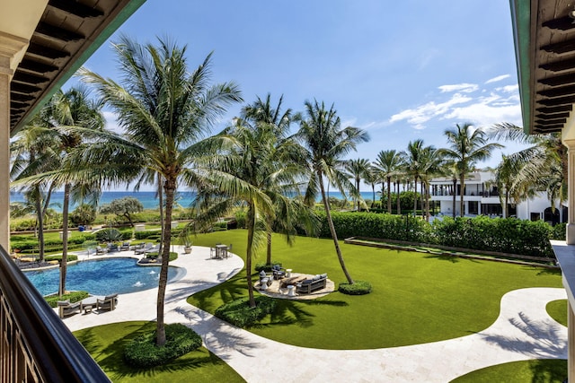 526 N Ocean Blvd, Delray Beach, FL 33483 - view of community with a patio, a pool, a water view, and a yard