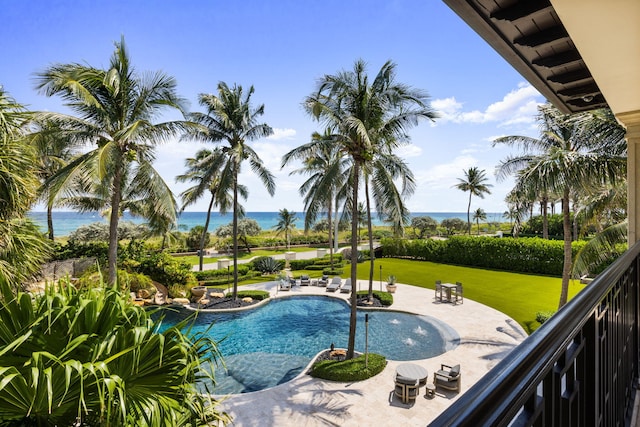 526 N Ocean Blvd, Delray Beach, FL 33483 - swimming pool with a patio, a lawn, and a water view