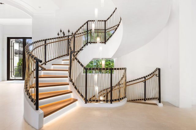 526 N Ocean Blvd, Delray Beach, FL 33483 - stairs featuring tile patterned floors and a towering ceiling