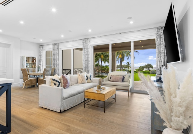 526 N Ocean Blvd, Delray Beach, FL 33483 - living room featuring recessed lighting, light wood finished floors, and baseboards