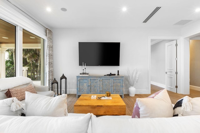 526 N Ocean Blvd, Delray Beach, FL 33483 - living room featuring baseboards, wood finished floors, and recessed lighting