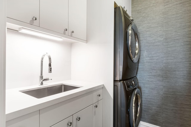 526 N Ocean Blvd, Delray Beach, FL 33483 - washroom featuring stacked washing machine and dryer and cabinet space