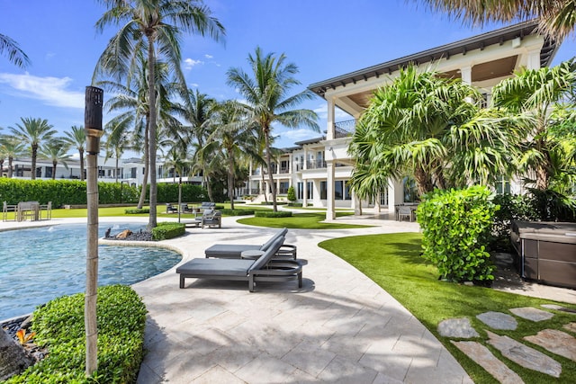 526 N Ocean Blvd, Delray Beach, FL 33483 - view of property's community with a pool, a patio, and a yard