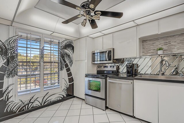 1858 SW Palm City Rd Unit 205, Stuart, FL 34994 - kitchen featuring appliances with stainless steel finishes, a sink, ceiling fan, and white cabinets