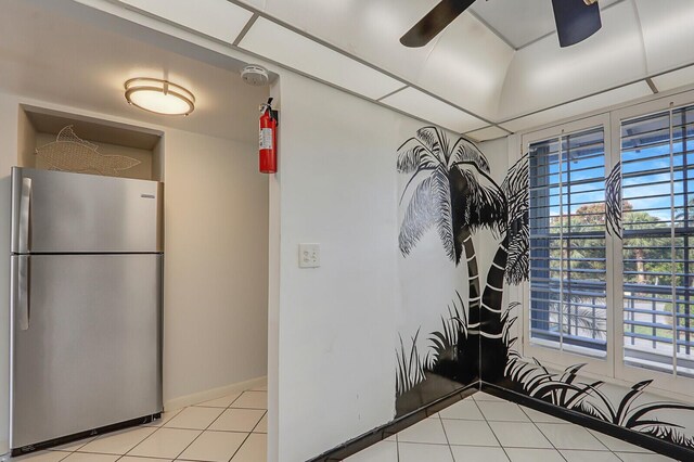 1858 SW Palm City Rd Unit 205, Stuart, FL 34994 - kitchen featuring freestanding refrigerator, light tile patterned flooring, and a ceiling fan