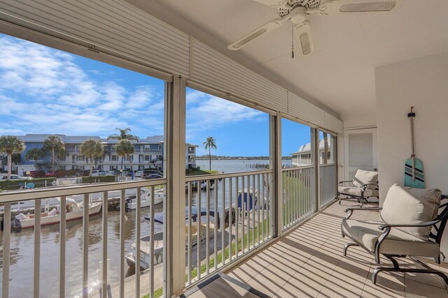 1858 SW Palm City Rd Unit 205, Stuart, FL 34994 - sunroom featuring a water view, lofted ceiling, and plenty of natural light