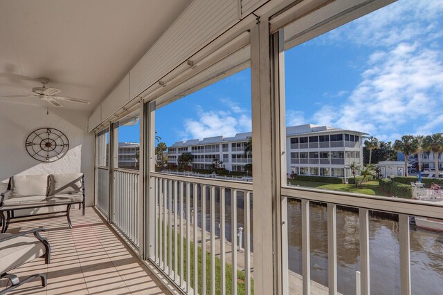 1858 SW Palm City Rd Unit 205, Stuart, FL 34994 - balcony with a water view and a ceiling fan
