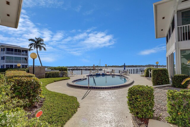 1858 SW Palm City Rd Unit 205, Stuart, FL 34994 - community pool featuring a water view