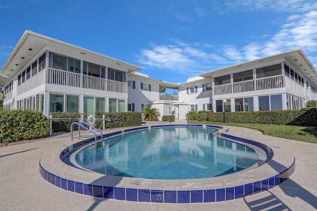 1858 SW Palm City Rd Unit 205, Stuart, FL 34994 - community pool featuring a sunroom