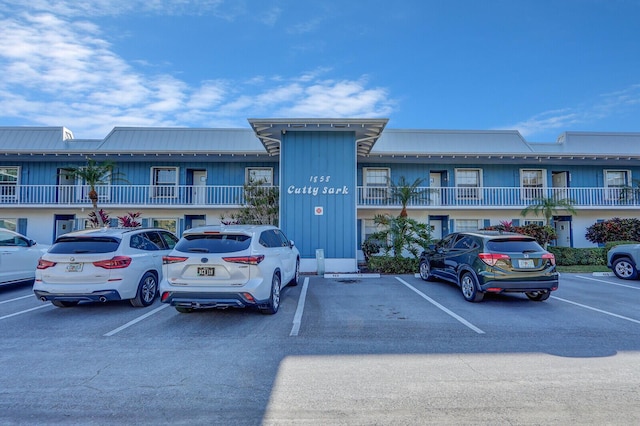1858 SW Palm City Rd Unit 205, Stuart, FL 34994 - view of building exterior featuring uncovered parking