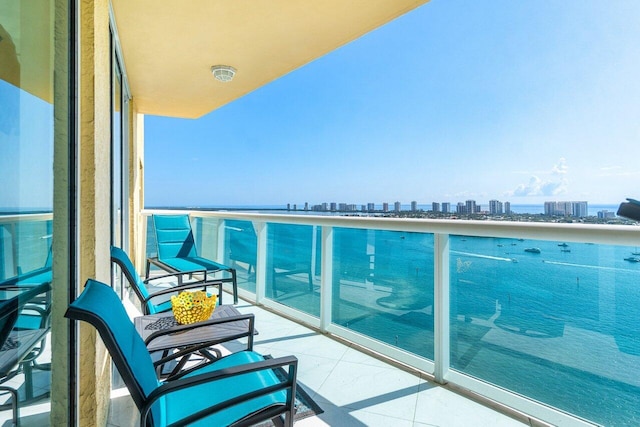 2640 Lake Shore Dr Unit 2307, Riviera Beach, FL 33404 - balcony featuring a skyline view and a water view